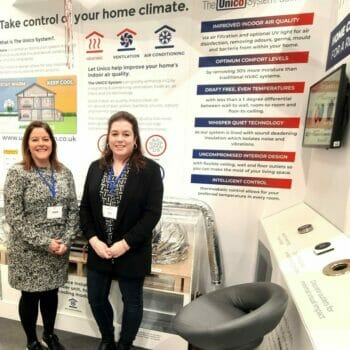 Maddie and Laura staying in front of the Unico stand at the NSBRC in Swindon