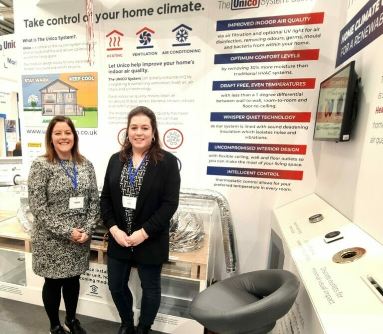Maddie and Laura staying in front of the Unico stand at the NSBRC in Swindon